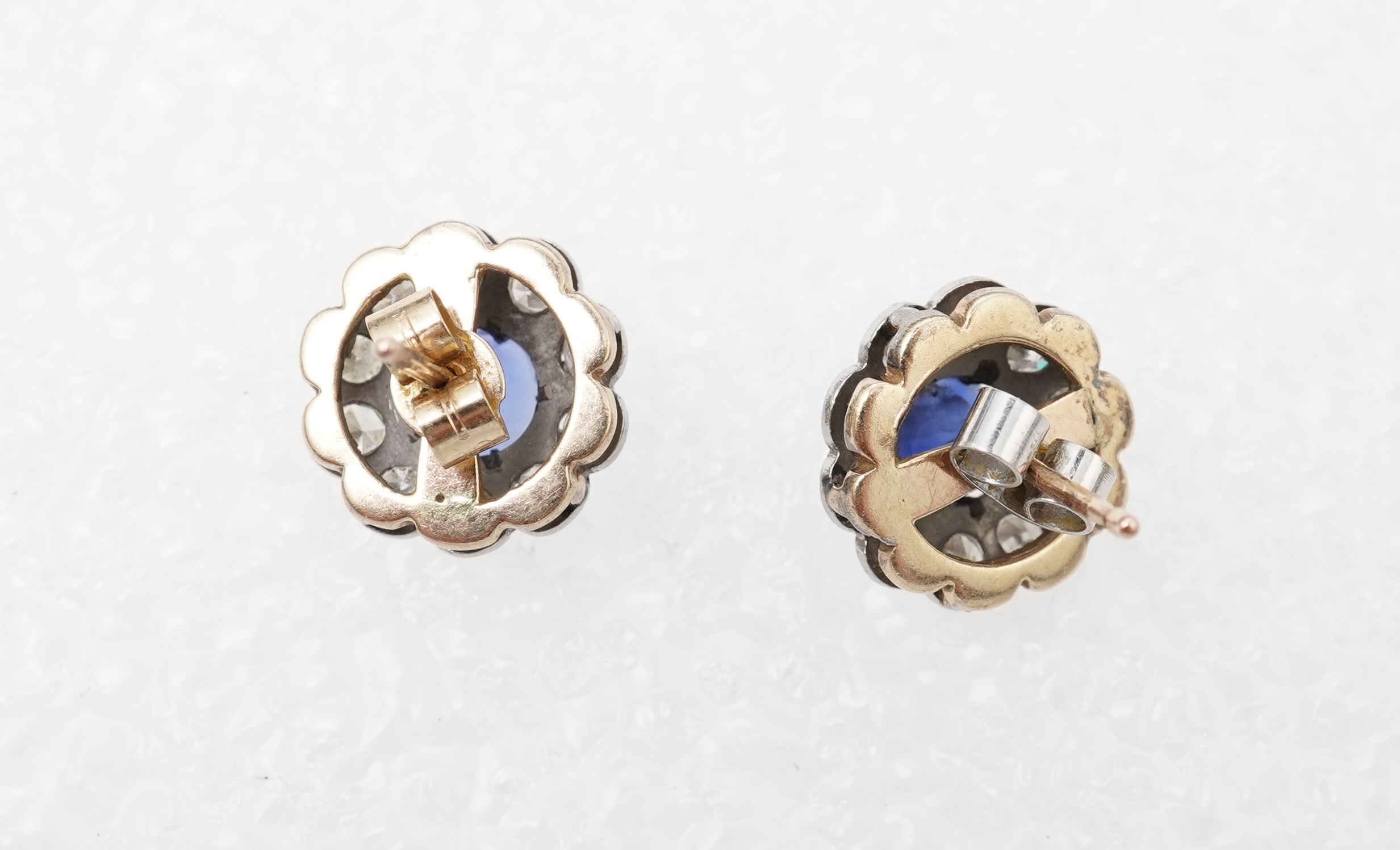 A pair of sapphire and diamond studs, mid 20th century